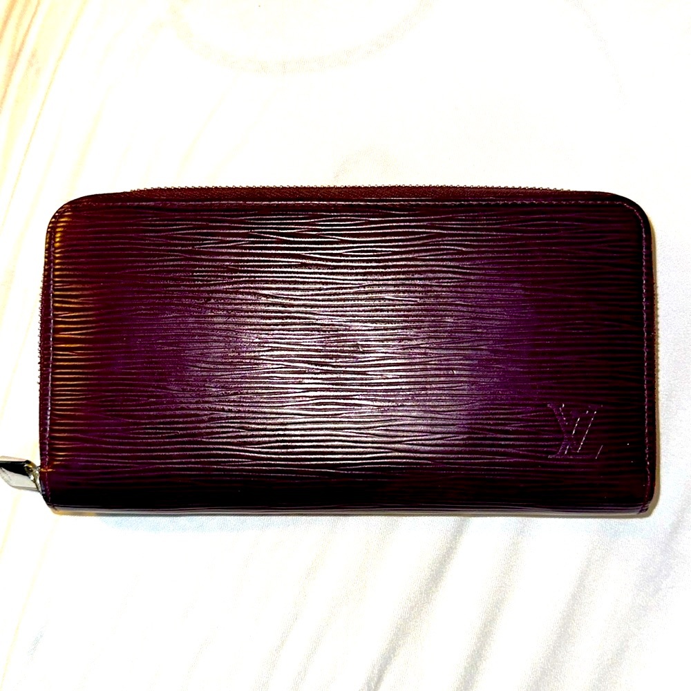 Louis Vuitton Purple Epi zippered wallet with box.
